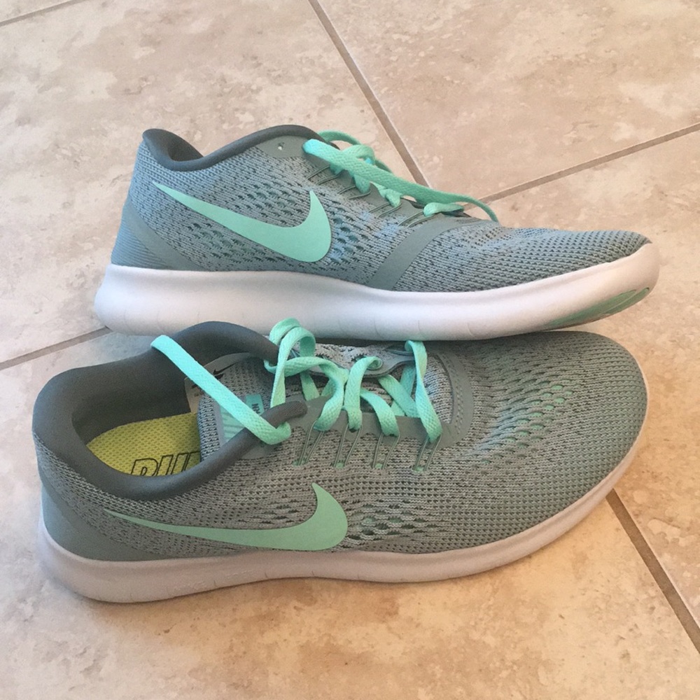 Mint green women’s Nike Free runs